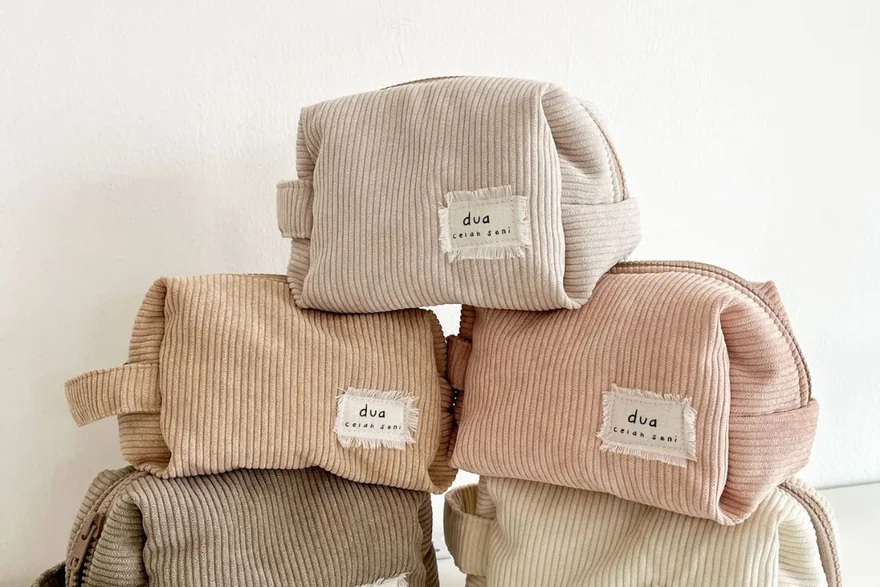 Assorted custom cosmetic bags, makeup bags and hanging toiletry bags produced for brand programmes